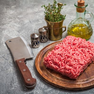 minced meat with seasoning and fresh thyme